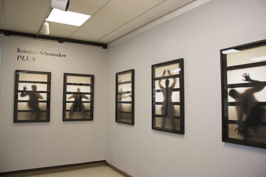 Artist Kristine Schomakers exhibition entitled PLUS featured her self-portraits at the Multicultural Day art exhibition in the administration building.