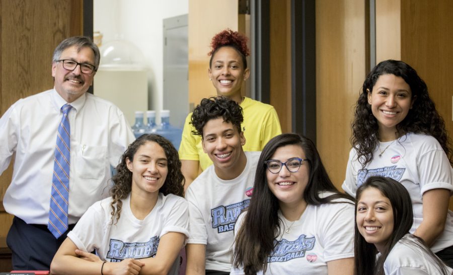 President Luis Sanchez congratulates Isabel Ayala, Mia Moore, Breanna Calhoun, Barbara Rangel. Sarah Soto, and Jazmin Carrasco (left to right) of the womans basketball team on April 9 in the administration building. Celebration was a part of multicultural day.