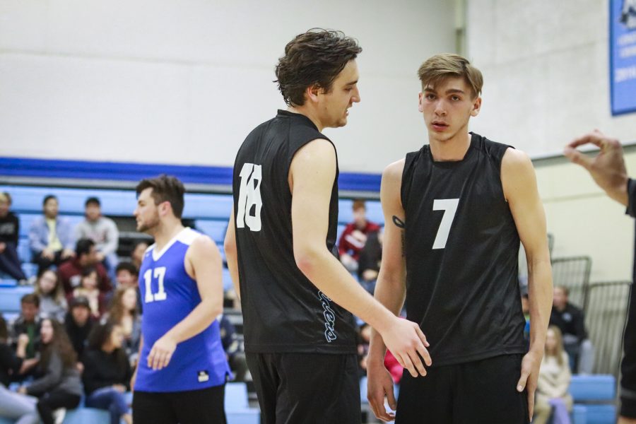 Freshmen Steven Weese, left, and Ryan Horan talk strategy mid-game during Moorparks first conference game against Santa Barbara City College, on Wednesday, Feb. 27 in the Moorpark. College gym. Weese, Moorparks setter, ended the night with 35 assists. Photo credit: Evan Reinhardt