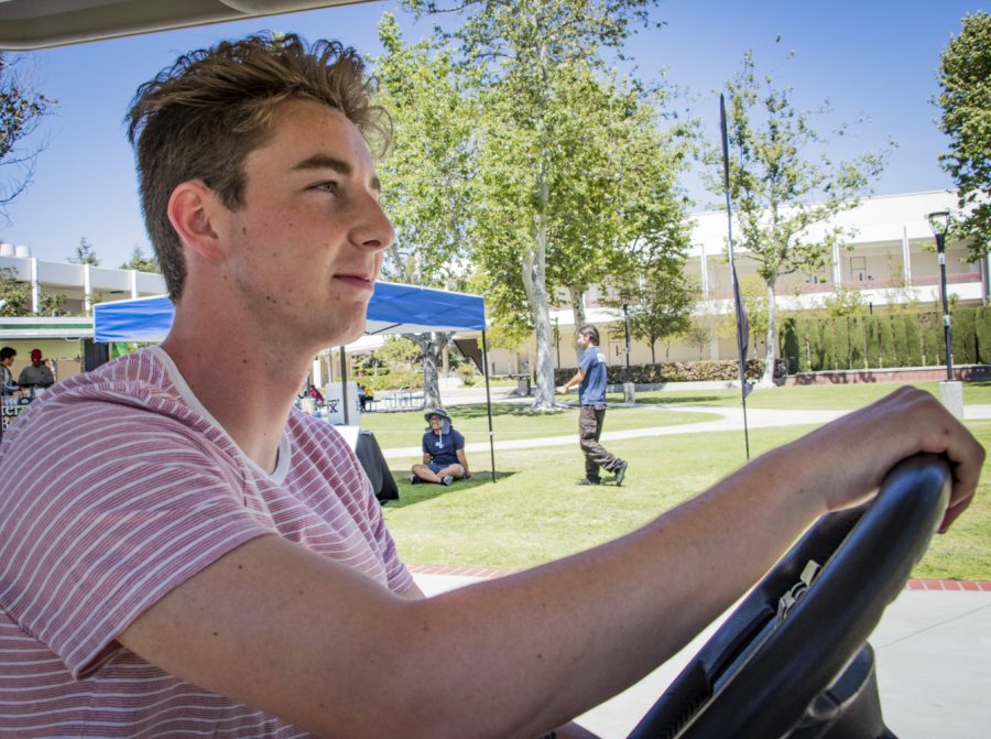 Wyatt Endres, a global studies  drives around the Moorpark College campus completing tasks for ASMC on Tuesday, April 23. Endres hopes to steer the ASMC towards a brighter future as the newly elected president for next semester. Photo credit: Evan Reinhardt
