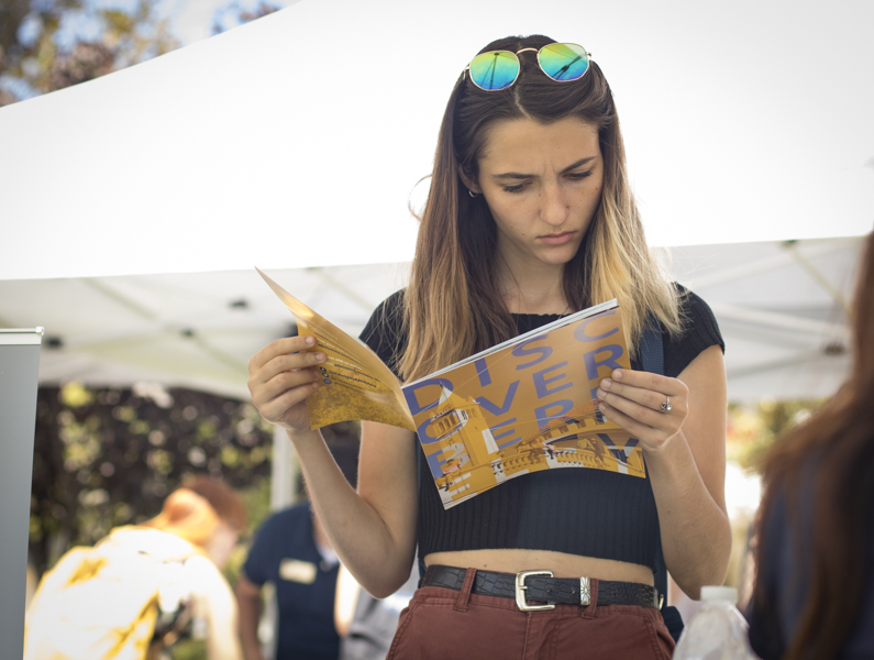 Sophomore Madeleine Salvay reads an informational transfer booklet supplied by University of California Berkley, during Transfer Day on Thursday, Aug. 28. Salvay hopes to transfer to a school on the west coast after leaving Moorpark. Photo credit: Evan Reinhardt