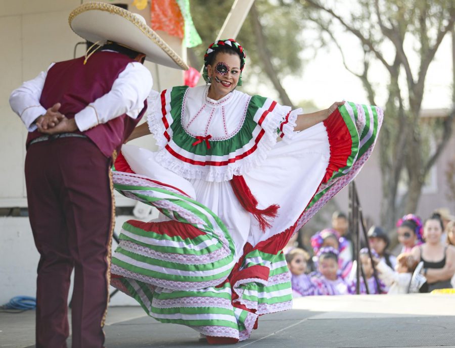 Carmen Gil dances with her husband Juan Gil during a charismatic folk dance at the Dia de los Muertos Festival in Simi Valley on Sunday, Oct. 27. Photo credit: Ryan Bough