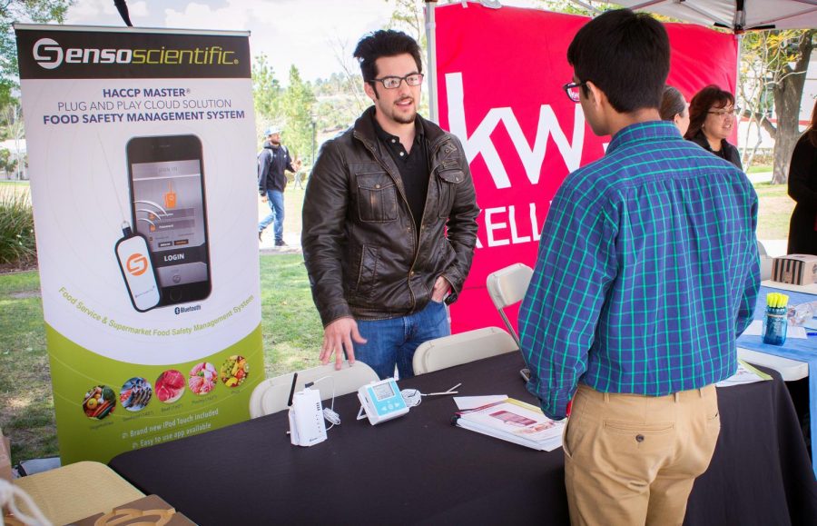 Michael Black (left), 22, talks Mohit Sukhija, 18, a quality manager from SensoScientific, at the Career and Intership Expo on campus at Moorpark College on Wednesday, March 14, 2018. Many companies like SensoScientific are searching for innovative minds at Moorpark College. Photo credit: Evan Reinhardt