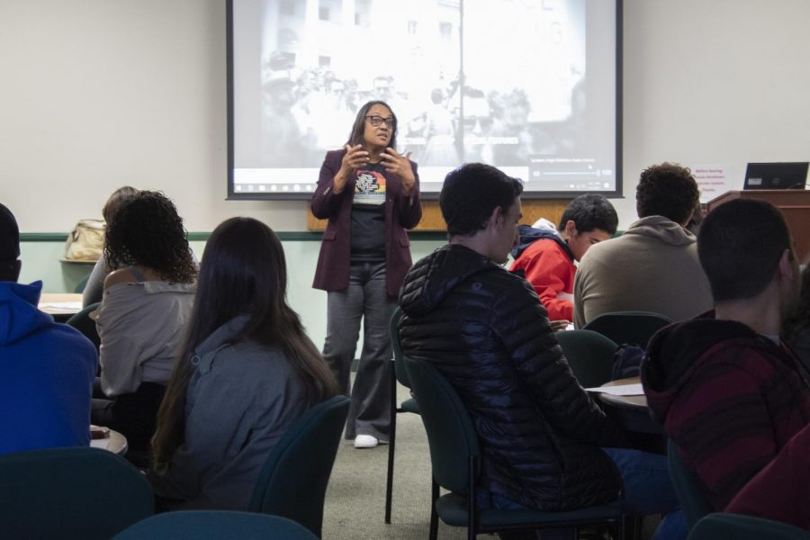 Tamarra Coleman, English Professor and Multi-Cultural Project Specialist, speaks to Students before showing the movie ‘I am not your Negro’ for Black History Month, on Wednesday, Feb. 5. The movie was shown in the Campus Center Conference Room. Photo credit: Scott Mazzarano