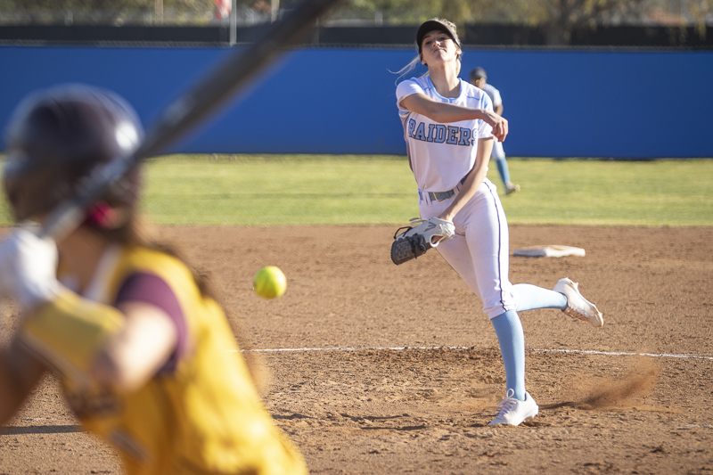 Freshman+pitcher+Ashley+Wernli+launches+a+ball+to+the+catcher+on+Tuesday%2C+Feb.+18%2C+during+the+Raiders+home+game+against+Victor+Valley+College.+Wernli+pitched+the+whole+game+for+the+Raiders.+Photo+credit%3A+Evan+Reinhardt