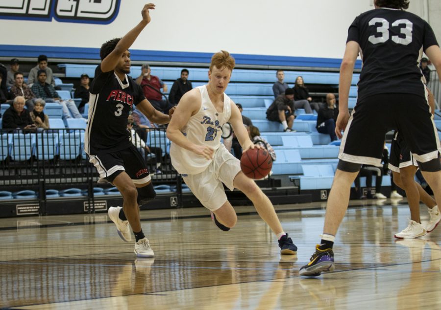 Sophomore guard Tim Andreolli takes it to the hoop during Moorparks home game against Pierce College on Wednesday, Feb. 5. Photo credit: Evan Reinhardt