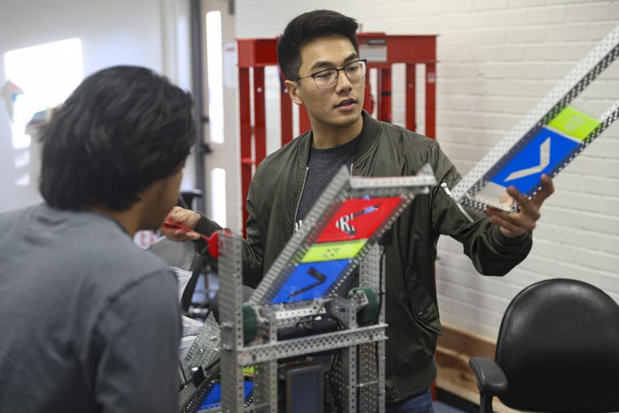 Khoi Le, the lead builder, examines a part of the engineering clubs robot hai-8s, on Tuesday, Feb. 11, at Moorpark College. The engineering club qualified for the VEX Robotics World Championship in Kentucky. Photo credit: Ryan Bough