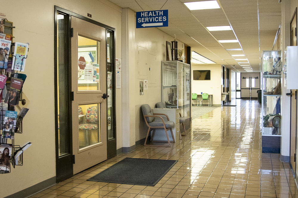 The Student Health Center remains closed to students on Tuesday, March 17, in the Administration building. Posters describing symptoms of COVID-19 are stuck up on the entrance.