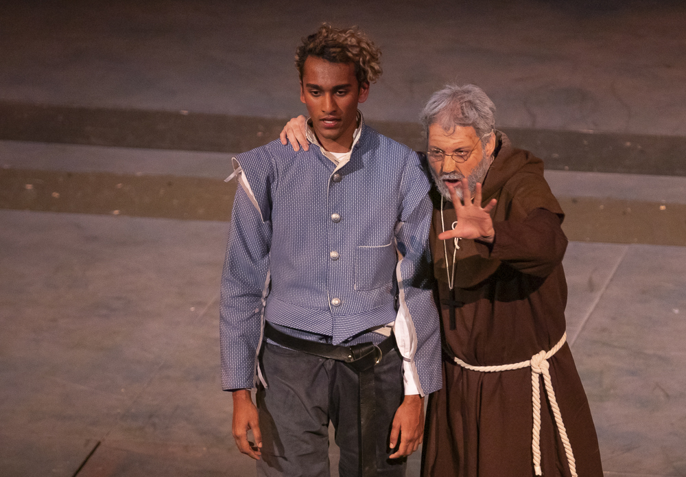 Seth Gunawardena, as Romeo, listens to advice from Pi McAuliffe, as Friar Lawrence during the performance of Romeo and Juliet on Tuesday, March 12, in the performing arts building.