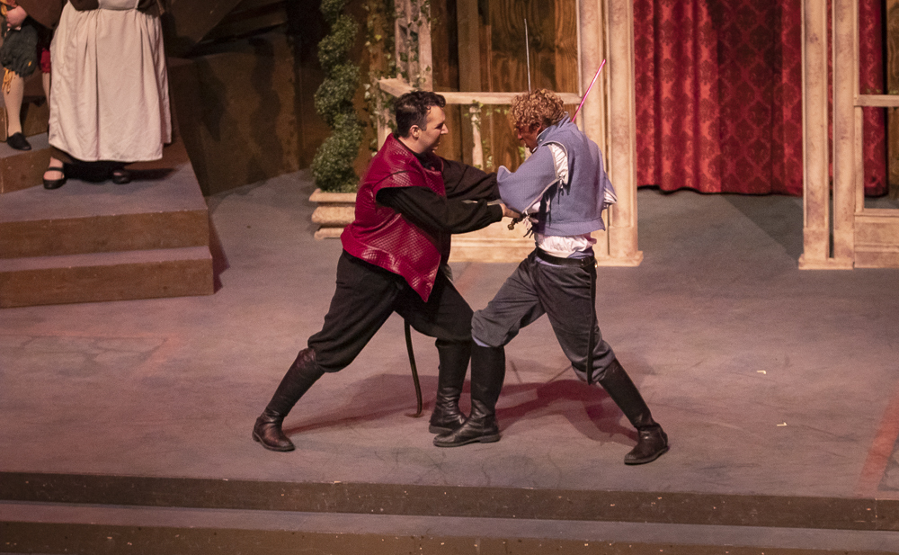Jaz Johnson, left, as Tybalt, engages in a duel with Seth Gunawardena, as Romeo, during the Romeo and Juliet performance on Thursday, March 12, in the performing arts building.