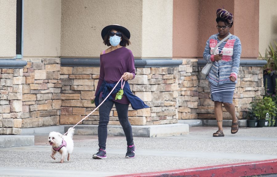 Gloria Szabo, Moorpark resident, takes her dog Princess for a walk to get some exercise during quarantine on Friday, April 10. Photo credit: Evan Reinhardt