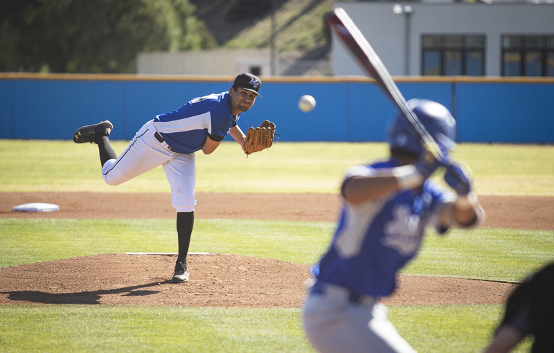 Freshman Noah Balandran launches a pitch at the Bulldog batter during Moorparks home game against Allan Hancock College on Thursday, Feb. 20, 2020. Photo credit: Evan Reinhardt