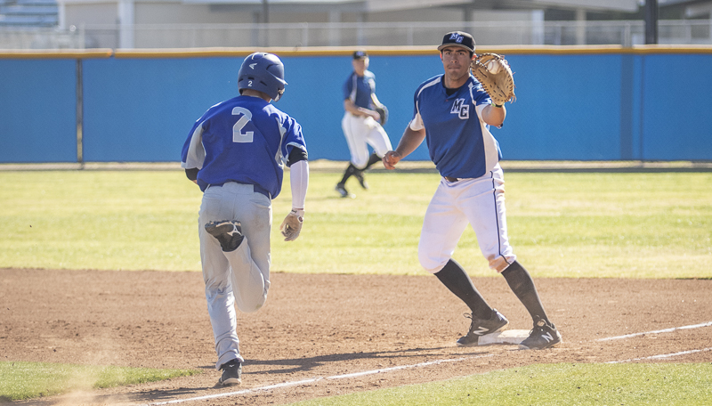 Sophomore Alex Vega catches the ball right before the runner tries to tag first base during Moorpark's home game against Allan Hancock College on Thursday, Feb. 20, 2020.