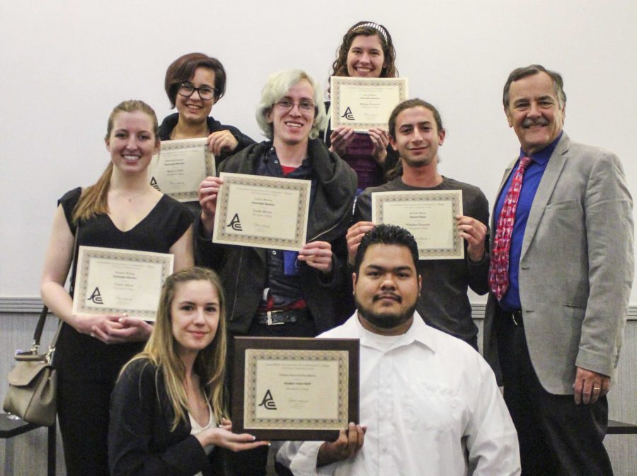 The Student Voice staff displays their awards on Saturday, March 20. From left, Casey Ahern, Kayla Colon, Leslie Kivett, Bridget Fornaro, Nikolas Samuels and Student Voice adviser Michael Hoffman. Front row from left, Jessica Frantzides and Agustin Garcia. Photo credit: Gabrielle Biasi
