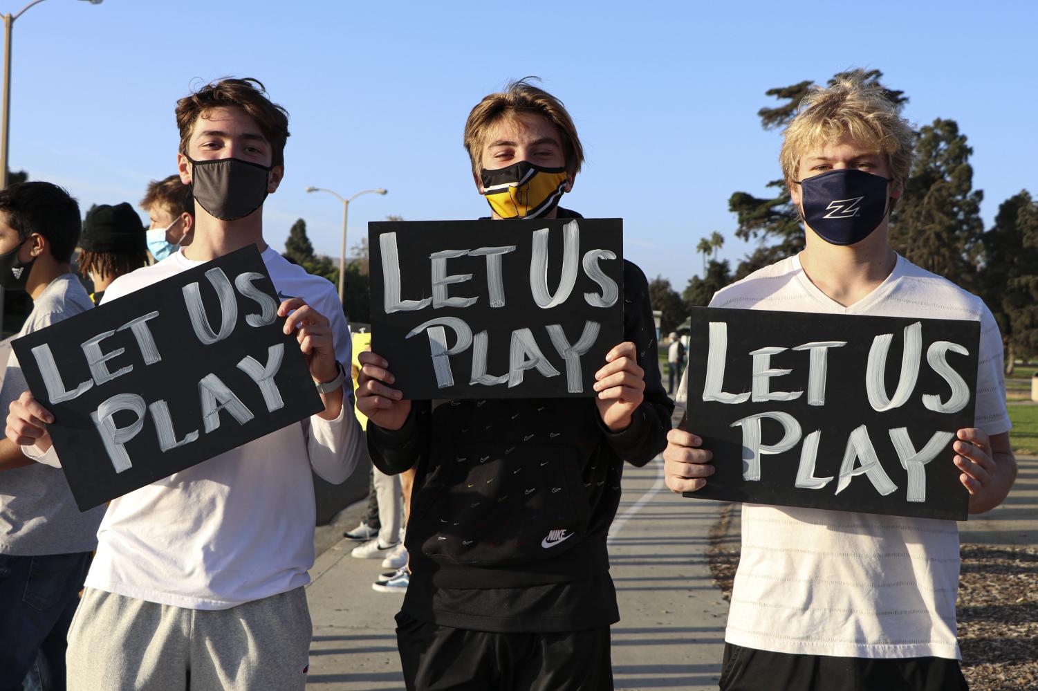Ventura High School athletes Giacomo Sherman, Logan Bobis, Noa McGee participate in the Let Us Play Rally in Ventura, CA