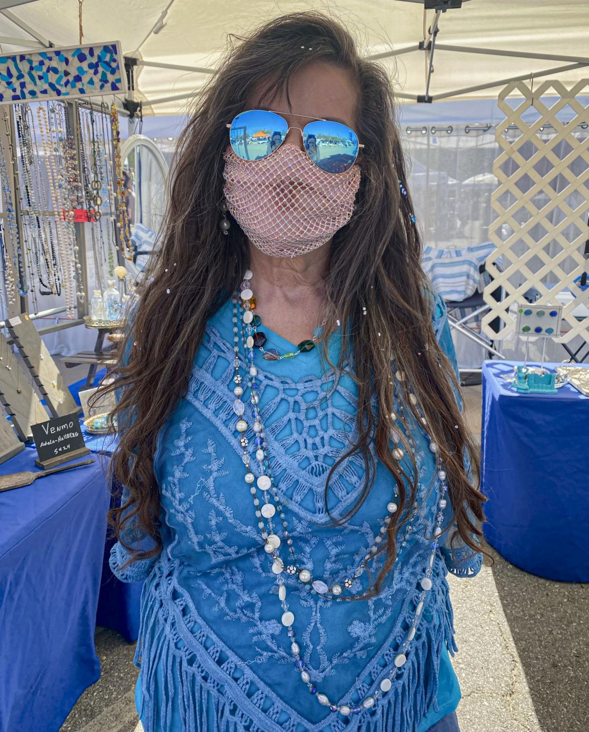 Adela Hallberg, owner of “Vintage Sea Cottage”, shows off her hand made necklaces that she is wearing, along with the “mermaid sparkles” that she has in her hair on Saturday, February 27 in Thousand Oaks, CA.