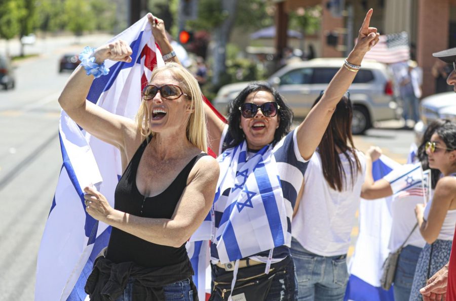 Leah Orly and Gali Reuben show their support for Israel at a protest in Agoura Hills, CA. on Sunday, May 23, 2021. The protest was to demonstrate support for Israel after the May 21 ceasefire between Israel and Hamas. Photo credit: Ryan Bough
