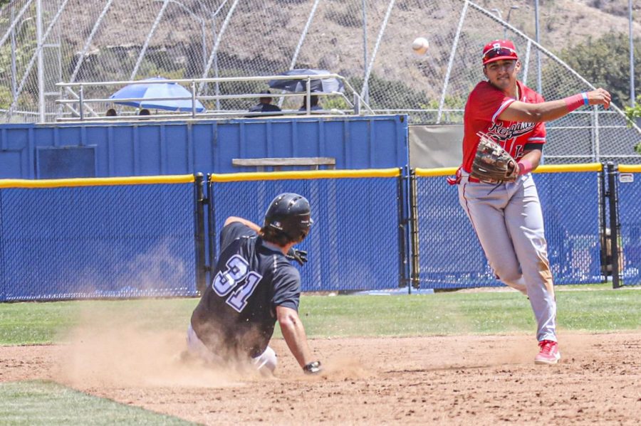 Freshman catcher Robert Rehman slides into second base in an attempt to avoid the double play in the first game of Moorparks home doubleheader versus Bakersfield College on May 8, 2021. Photo credit: Danny Stipanovich
