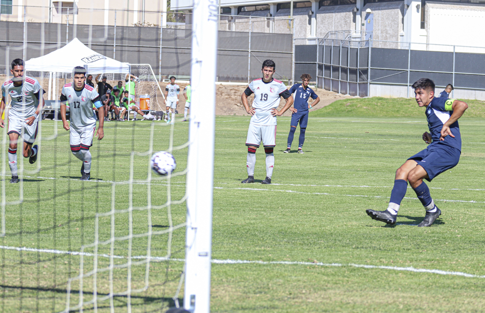 Sophomore midfielder Johnny Morales shoots a penalty kick in the second half of the Tuesday, Sept. 14 game that took place in Moorpark, California.