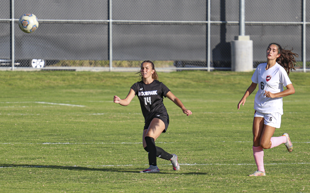 Moorpark Freshman Defender Katelyn Lathrop kicks a ball out of her teams half to get the pressure off the defense. Moorpark would end up not giving up a goal against Pierce college.