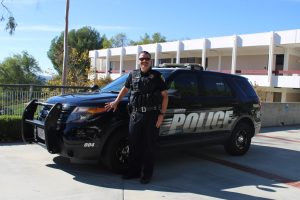 Lieutenant Andrew Huisenga poses in front of a Police car on the main campus of Moorpark College on Nov. 15. Photo credit: Christina Mehr