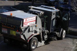 An Athens Services trash truck sits empty in a parking lot off Hillcrest and Wilbur in Thousand Oaks. These lots are currently being used to store trash bins, containers, and act as a home hub for the trucks. Photo credit: Christina Mehr