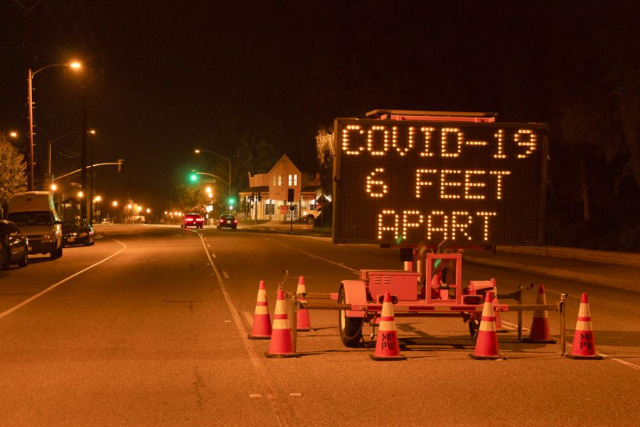 A sign on Princeton Ave. in Moorpark, California  alerts people to follow social distancing measures during the coronavirus pandemic. Photo credit: Justin Downes