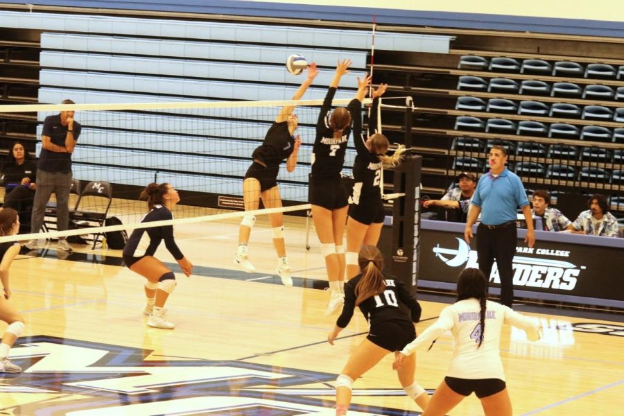 Setter Brooke Bunker and middle hitter Ryann Gaglio attempt to block a Miracosta Spartans point on October 8, 2022. This match took place at Moorpark College, CA. Photo credit: Briana Cruz