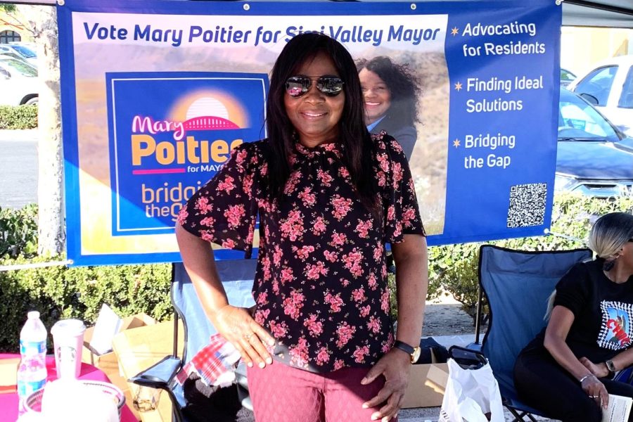 Mary+Poitier+stands+in+front+of+her+campaign+banner+at+the+Simi+Valley+Street+Fair+on+Oct.+29%2C+2022.+Photo+Credit%3A+Andres+Garcia