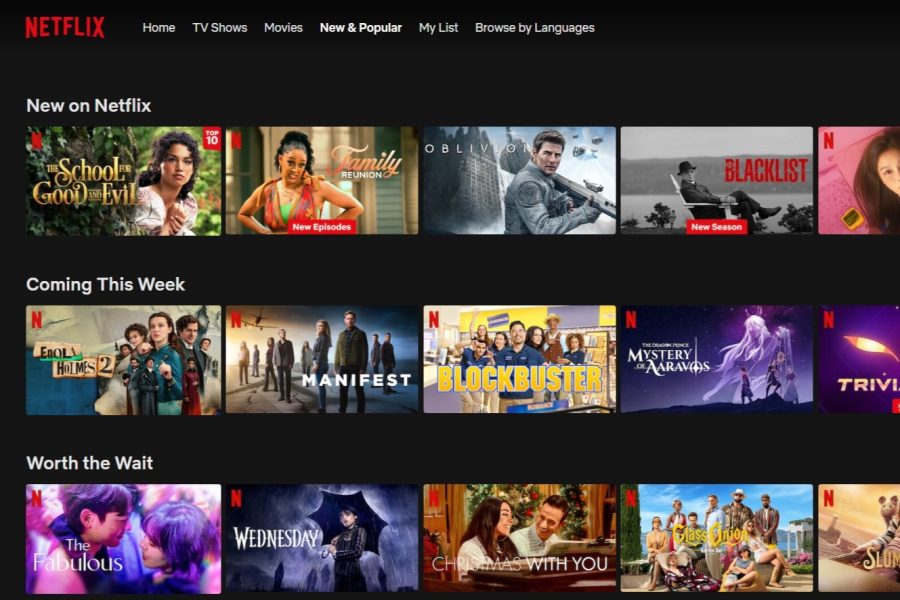 A laptop screenshot of the New and Popular tab on the streaming service Netflix. Netflix recently added a Basic with Ads subscription plan to its platform.
