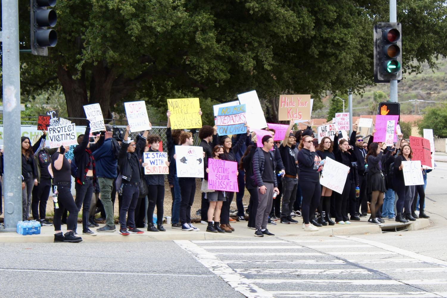 Moorpark College students and faculty marched to the busy intersection of Collins Drive and Campus Drive on Dec. 15 2022 to protest the handling of sexual misconduct on campus. Protesters were greeted by fellow students and community members honking to show their support.