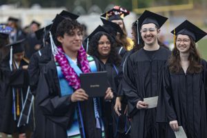 Moorpark College students wait in line to get their picture taken with a diploma during the 2023 graduation ceremony on Friday, May 19 in Moorpark, CA. Photo credit: Ryan Bough