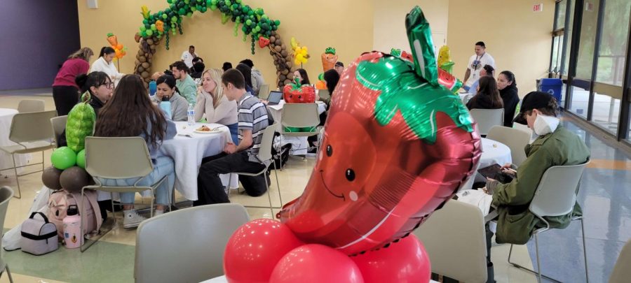 Students of Moorpark College celebrate the rebranding of Raider Central Basic Needs along with food themed decorations on April 17, 2023. Photo credit: Jeise Rogel