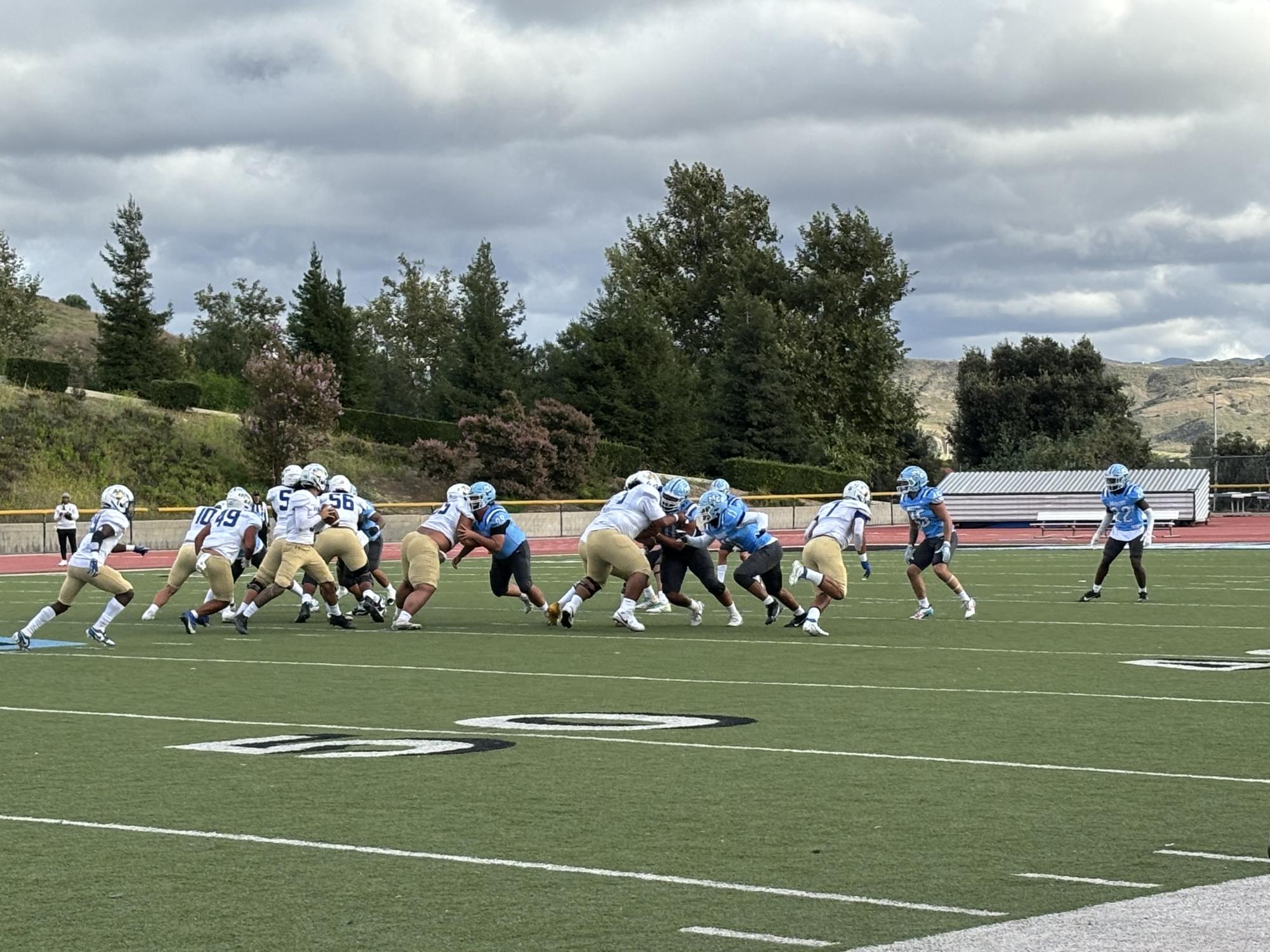The Moorpark Raiders' offensive line look to add on points as they try to get past the Allan Hancock Bulldogs defensive line in Griffin Stadium on Sept. 30, 2023.