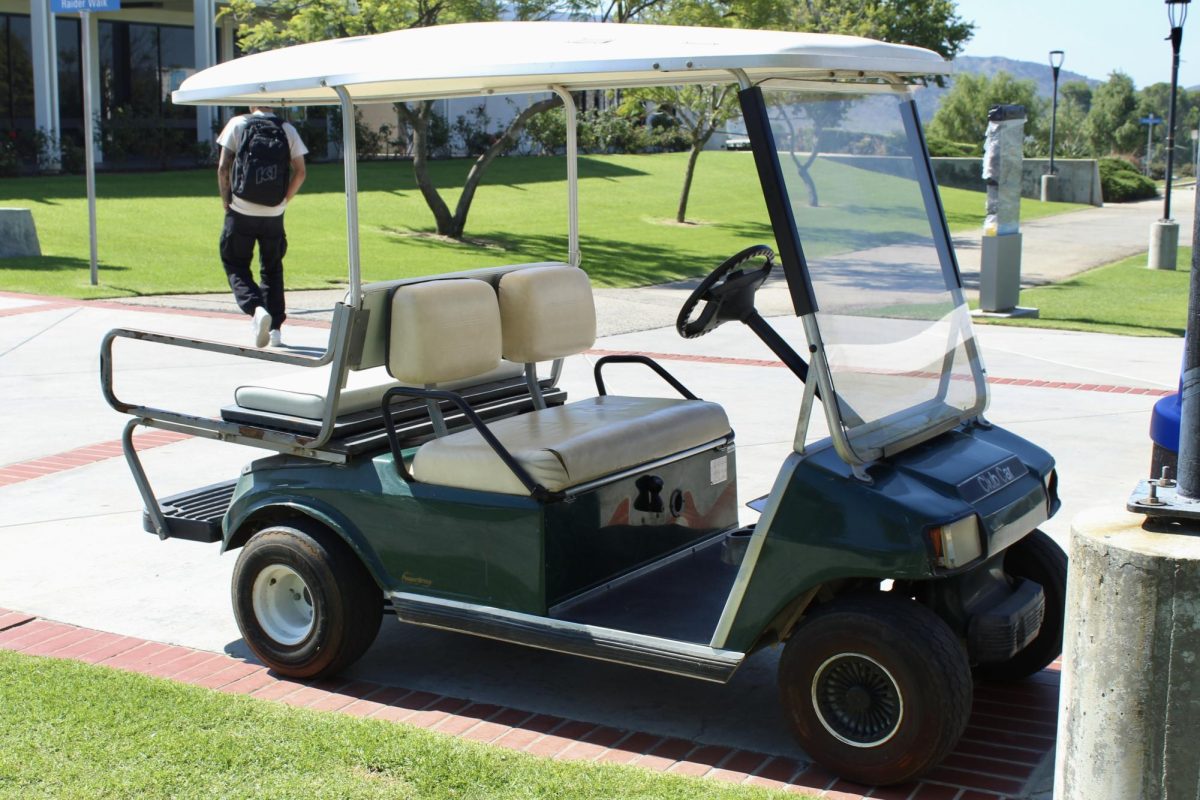 A Moorpark College-owned golf cart parked on Raider Walk on Sept. 26, 2023 during Club Rush. Photo credit: Brianna Perez