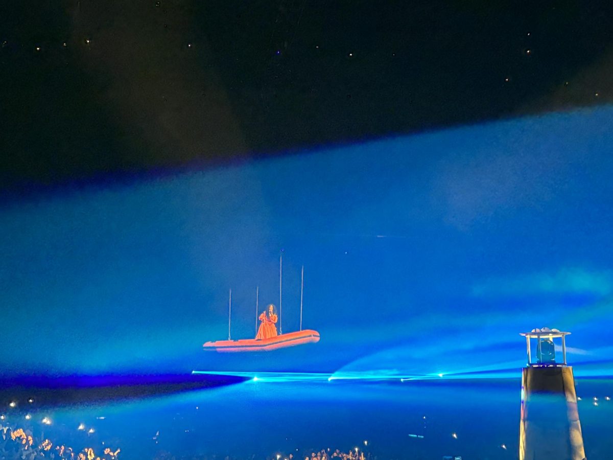 The iconic shot of SZA floating on a lifeboat over the audience appearing to show that the audience is under the water. Photo credit: Briana Cruz