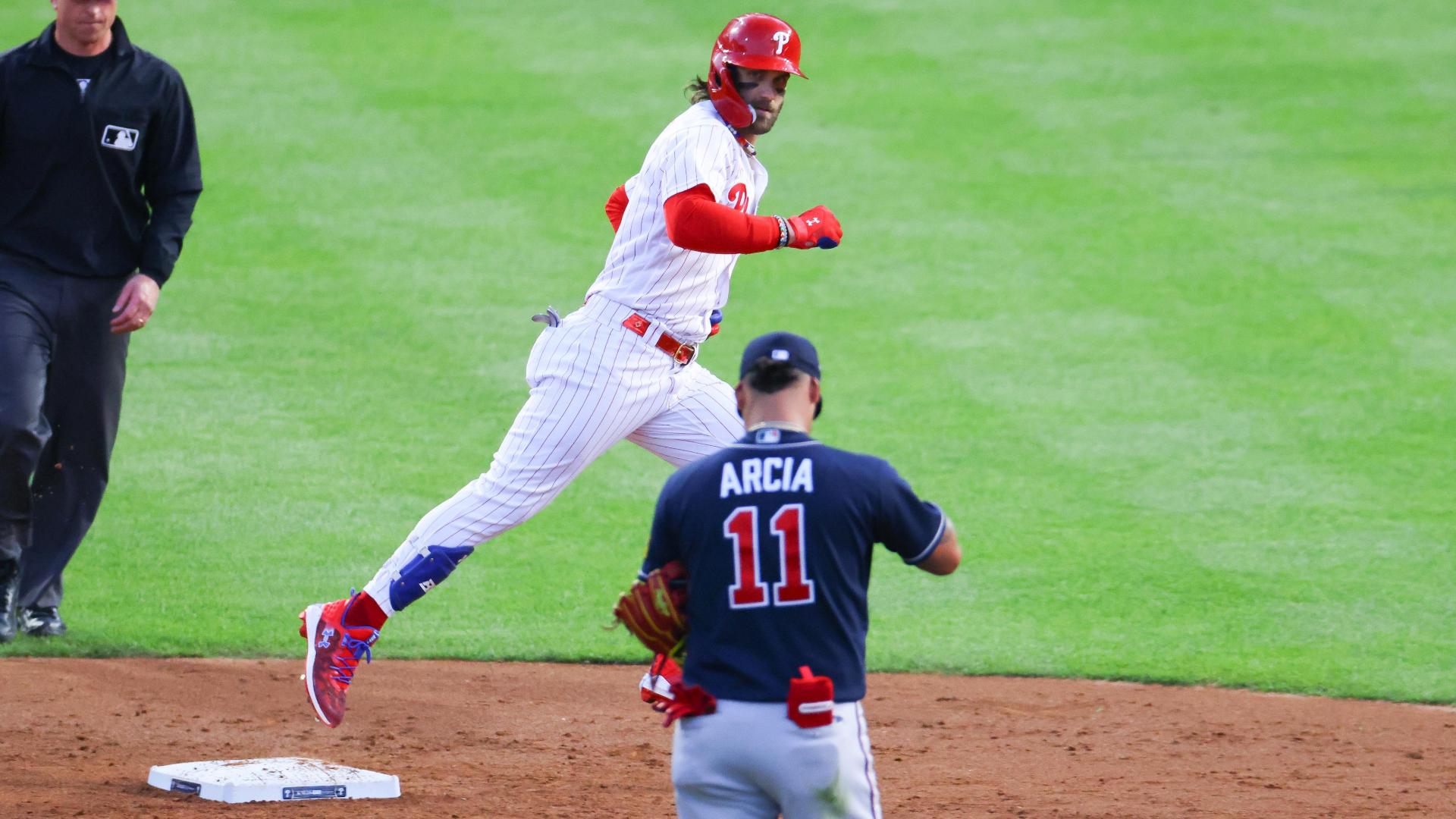 Phillies designated hitter Bryce Harper stares at Braves shortstop Orlando Arcia as he rounds second base in the 2023 MLB National League Divison Series. The Phillies would go on to defeat the Braves and move on to the next round in the playoffs. Image courtesy of ESPN's website.