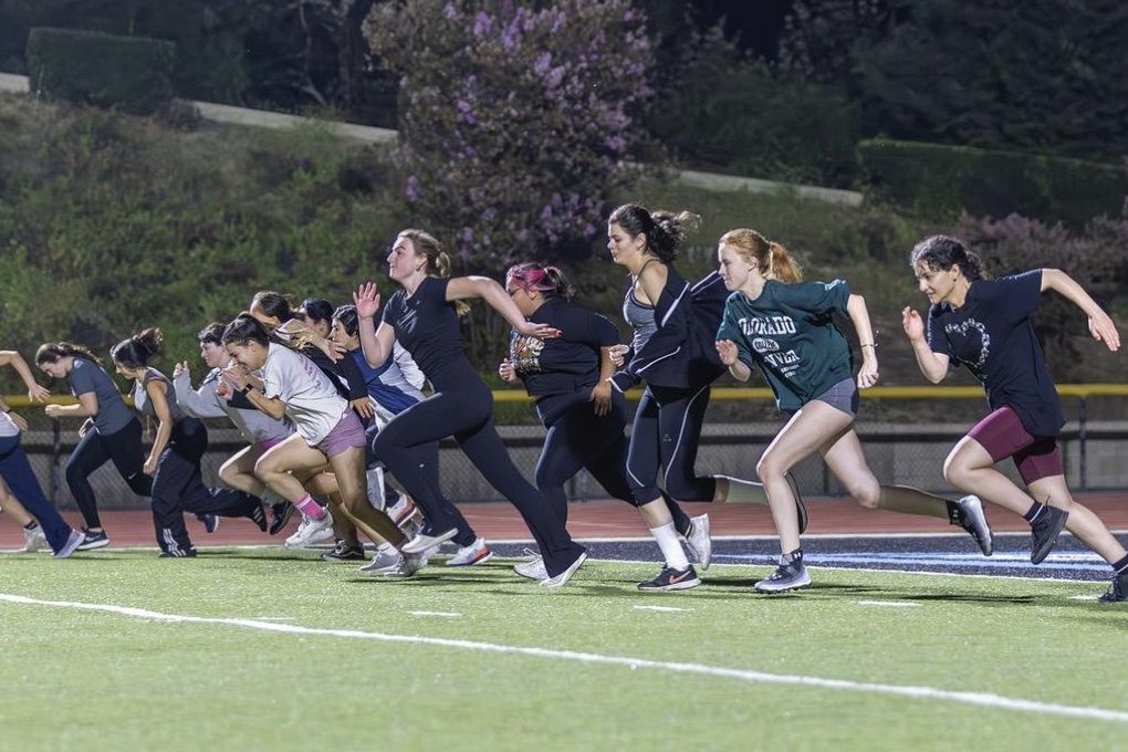 Members of the Moorpark College Women's Lacrosse Club run drills on the Griffith Stadium field during practice. Photo credit: Heidi Martin