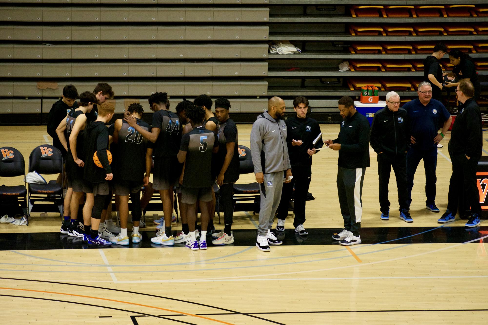 The Moorpark men's basketball players and staff regroup during the halftime intermission of their game against Ventura College on Feb. 10, 2024.