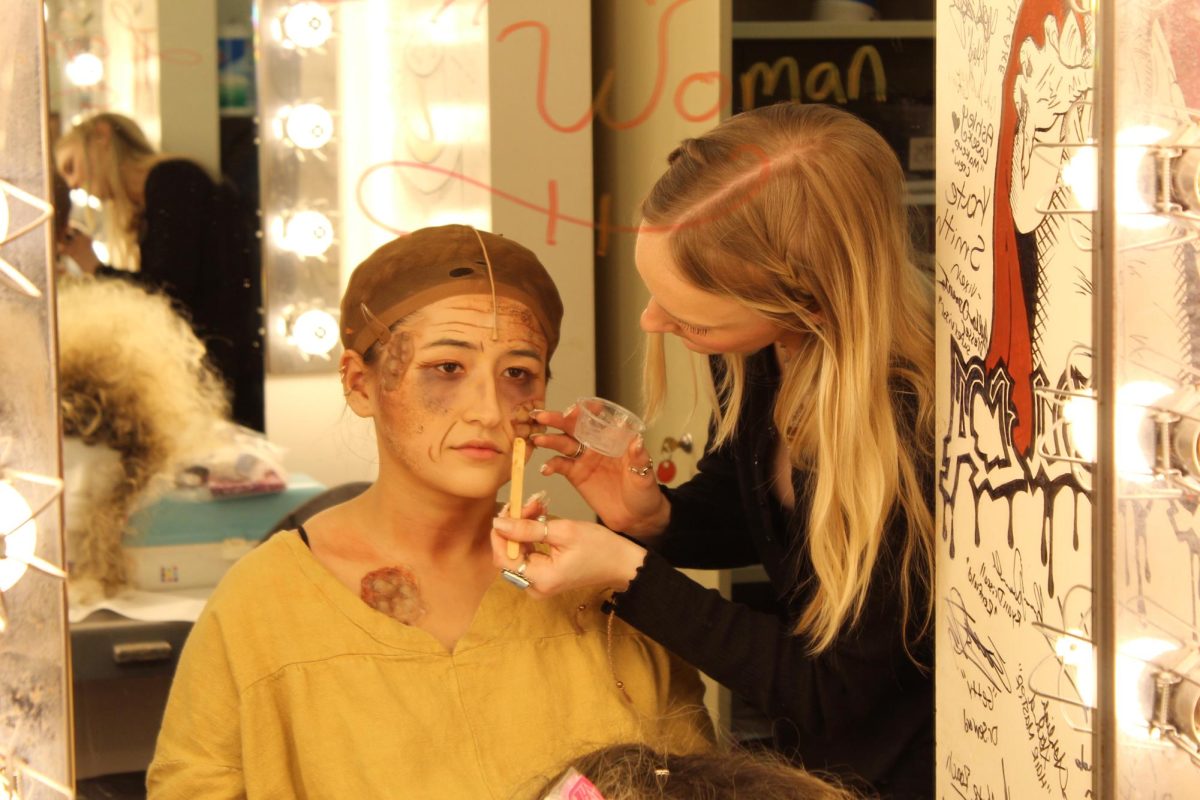 Makeup designer Nola Cannon applying makeup to Luna Aguilar (Beggar Woman) on the opening night of Sweeney Todd; The Demon Barber of Fleet Street on March 14, 2024. Photo credit: Sarah Graue