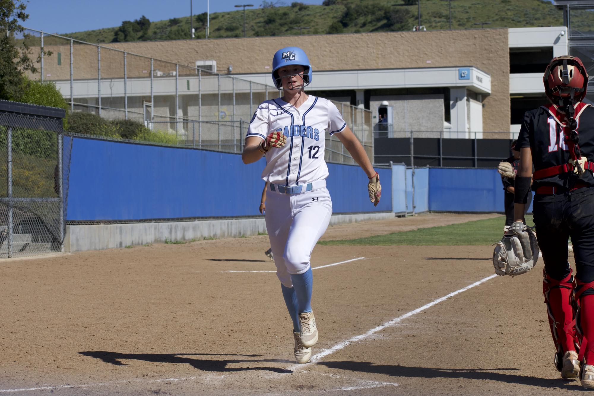 Moorpark freshman infielder #12 Dani Bishop strides to home plate to score for the Raiders at Moorpark College on April 16, 2024.