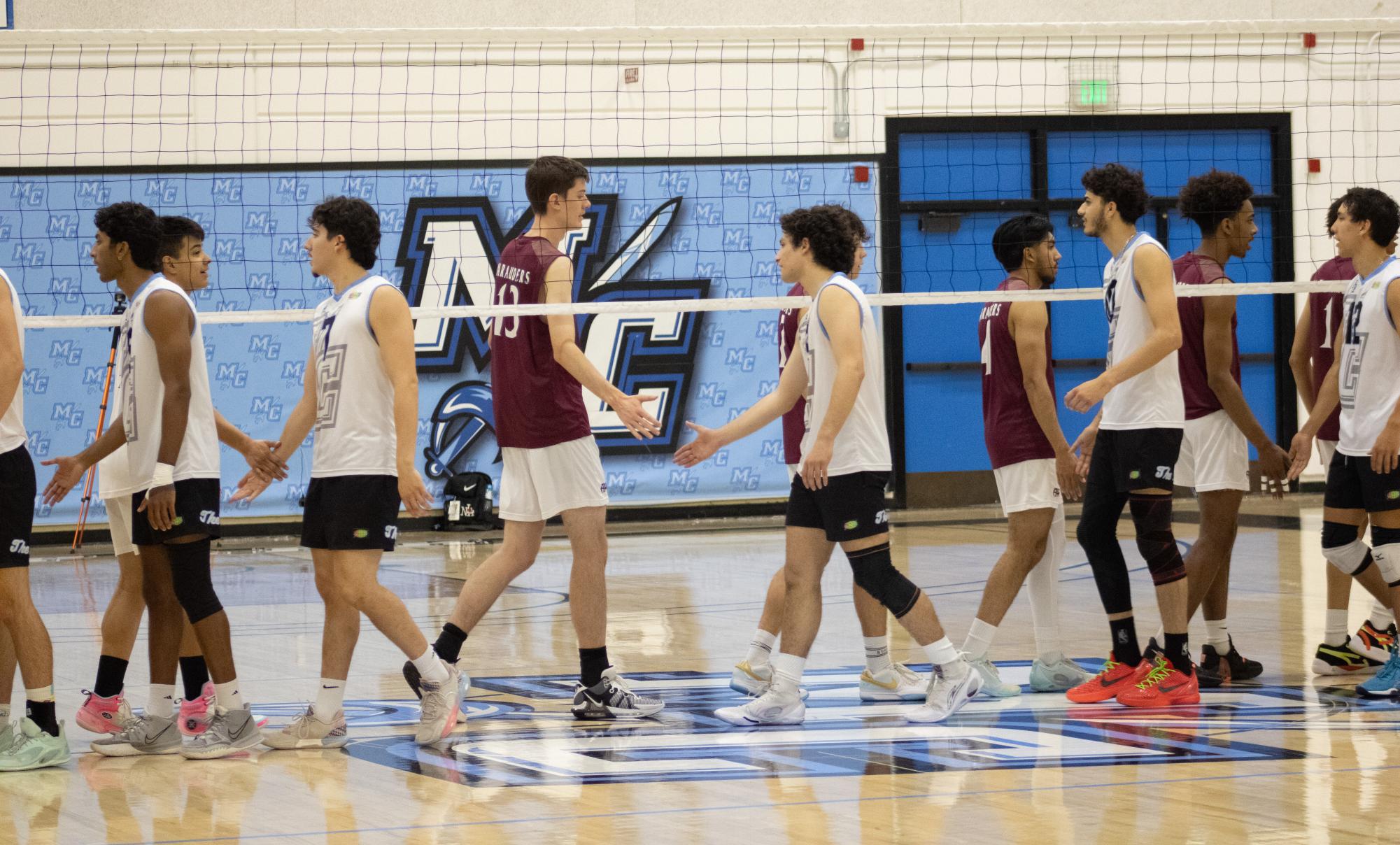The Moorpark College Raiders and the Antelope Valley Marauders shake hands before their volleyball match at Moorpark College in Moorpark, CA on April 12, 2024. Photo by Victoria McLaughlin.