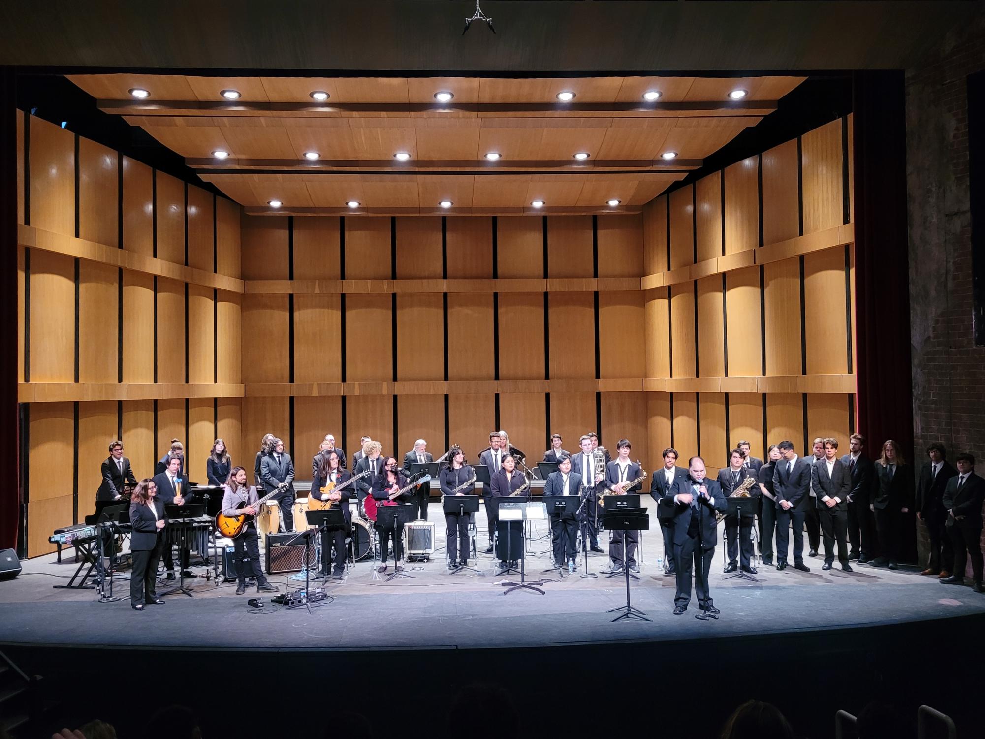 The Moorpark College Orchestra, Jazz Ensemble,
Andrew Synoweic, Virginia Figueiredo and Director Brendan McMullin standing for their final bow.