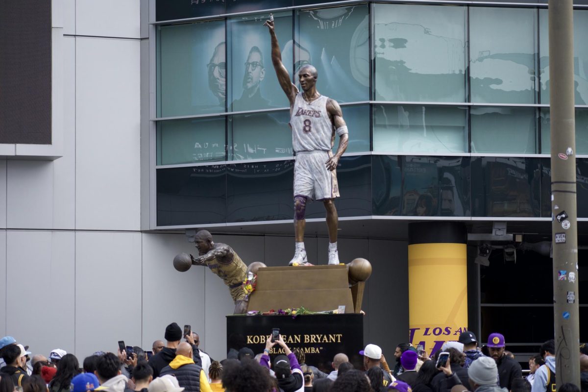 Crowds gathered outside Crypto.com Arena pay homage to Lakers legend Kobe Bryant as a statue of his likeness was unveiled on Feb. 8, 2024. Photo credit: Clayton Byrne