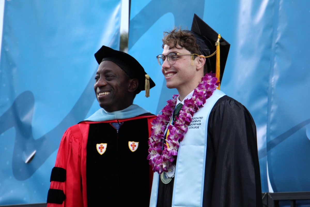 Moorpark College President Julius Sokenu and Associated Students of Moorpark College President Sean Rosskopf commemorate the commencement ceremony with photos on May 18, 2024. Photo credit: Sarah Graue
