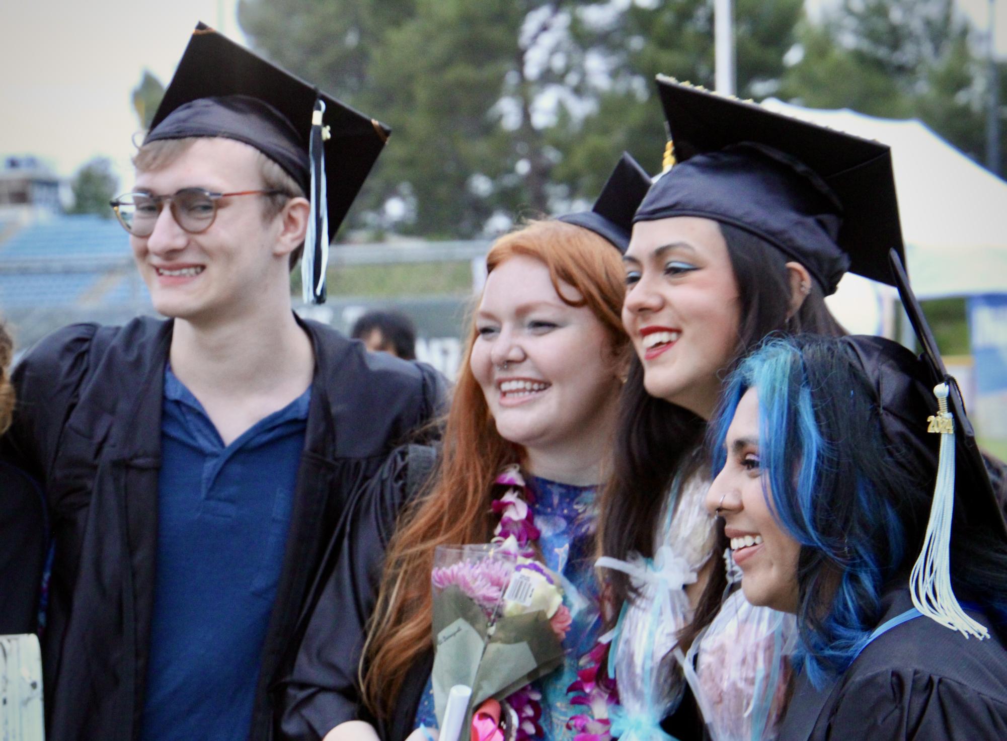 (Left to right) Zac Pelc, Anna Belle Sanders, LucÍa Salazar-Davidson and Amy Jimenez celebrate their graduation from Moorpark College after the evening commencement ceremony on May 17, 2024.