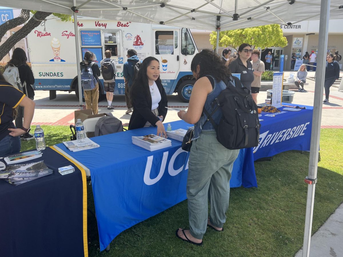 Trisha Gonzales, an assistant director in the Undergraduate Education Office at UCLA, talking to a student at Moorpark Colleges Transfer Social event on May 2, 2024. Photo credit: Natalie To
