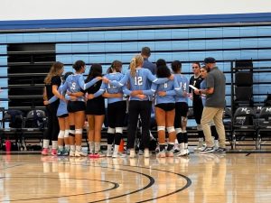 The Moorpark College women’s volleyball team huddles during a timeout against Cerritos, in Moorpark, Calif. on Wednesday, Sept. 11, 2024 Photo credit: Cameron Kritzer