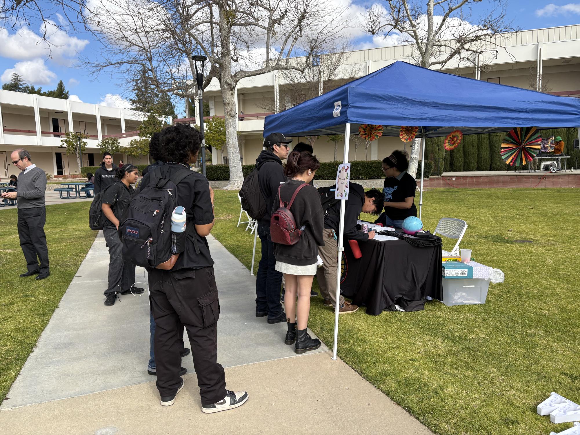 Students gathered around the BSU table along the pathway of the quad to get their complimentary shirts, lanyards, tickets and bags as part of celebrating Black History Month on Tuesday, Feb. 4, 2025 in Moorpark, Calif.