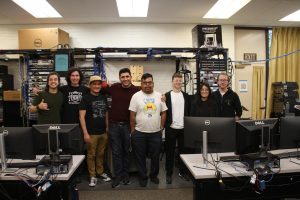 Members of the the Moorpark College Cybersecurity Club group together for a team photo during an NCL event. The team competed in this event in classroom T-212 at Moorpark College in Moorpark, Calif. The competitors are featured as followed from left to right: Christian Jaramillo, Eduard Petrov, Shaun Wakashige, Joshua Kohantab, Mario Penaloza, Bri Carlson, April Tran and Anthoney Kolter-Krause. Photo credit: Sharon Weinberg.